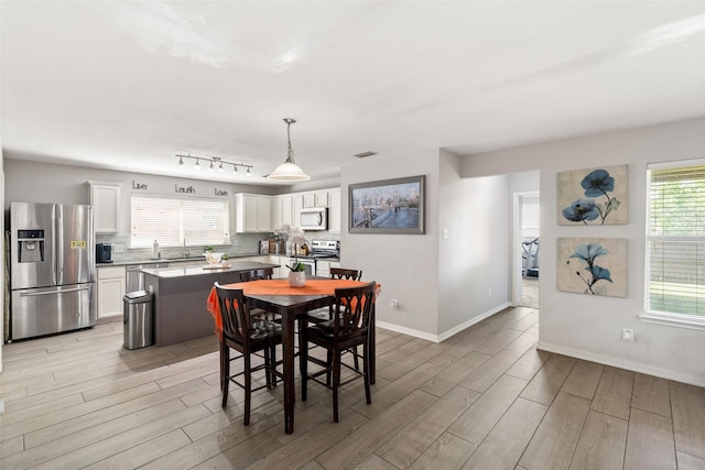 303 Highland Glen Dr, Wylie, TX 75098 - dining space featuring light wood-type flooring and baseboards
