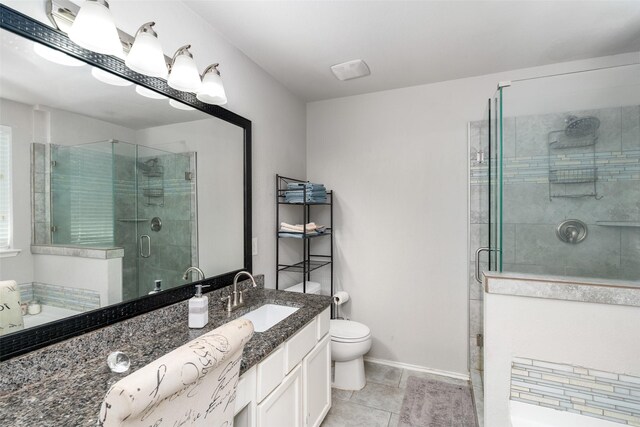303 Highland Glen Dr, Wylie, TX 75098 - bathroom with vanity, a stall shower, toilet, a garden tub, and tile patterned floors