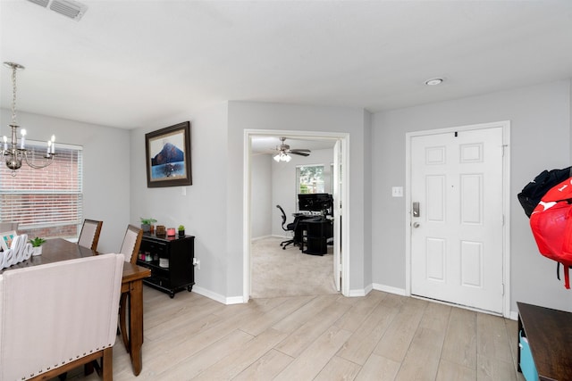 303 Highland Glen Dr, Wylie, TX 75098 - entryway with a chandelier, light wood finished floors, baseboards, and a ceiling fan