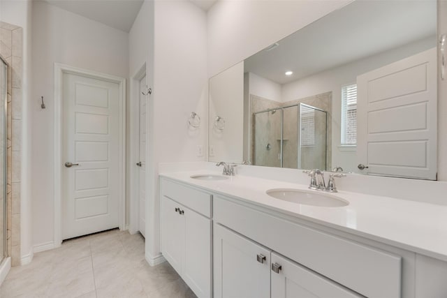 2705 Hancock Ln, Celina, TX 75009 - bathroom featuring a shower stall, double vanity, tile patterned flooring, and baseboards