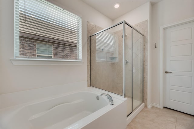 2705 Hancock Ln, Celina, TX 75009 - full bathroom featuring a bath, a stall shower, healthy amount of natural light, and tile patterned flooring