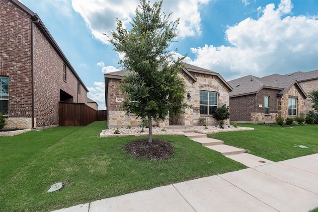 2705 Hancock Ln, Celina, TX 75009 - view of front of home featuring stone siding, brick siding, and a shingled roof