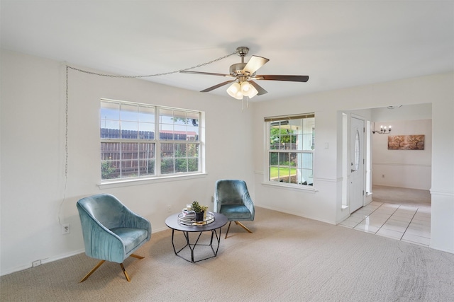 2825 Summit View Dr, Bedford, TX 76021 - living area with carpet, a chandelier, and a ceiling fan