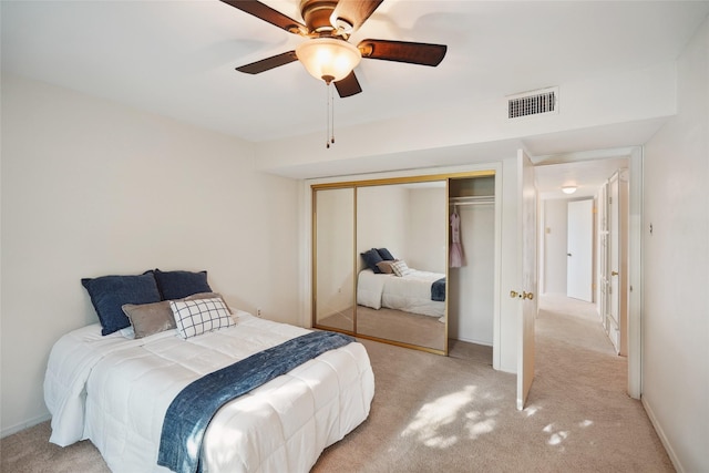 2825 Summit View Dr, Bedford, TX 76021 - bedroom featuring light colored carpet, a closet, and a ceiling fan