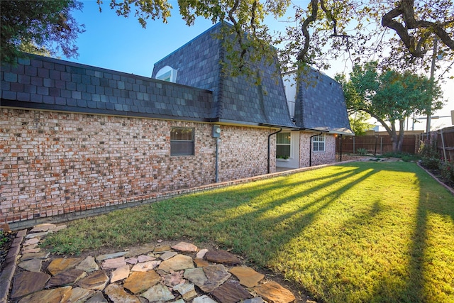 2825 Summit View Dr, Bedford, TX 76021 - rear view of property with mansard roof, a fenced backyard, and brick siding