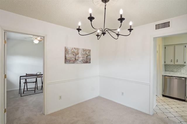 2825 Summit View Dr, Bedford, TX 76021 - unfurnished dining area with a chandelier, light carpet, a textured ceiling, and ceiling fan