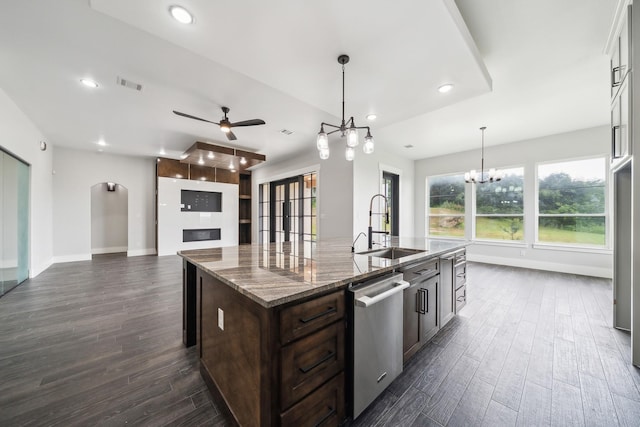 2522 Hardwick Ln, Cedar Hill, TX 75104 - kitchen featuring dishwasher, a sink, dark wood-type flooring, dark brown cabinetry, and a ceiling fan