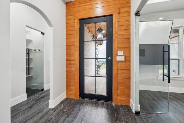 2522 Hardwick Ln, Cedar Hill, TX 75104 - foyer entrance featuring baseboards, dark wood-style floors, and arched walkways