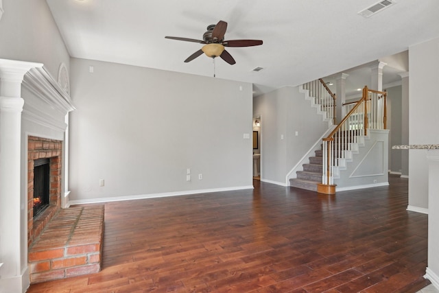 600 Harrison Hill Ct, Coppell, TX 75019 - unfurnished living room featuring a ceiling fan, a fireplace, wood finished floors, and stairway