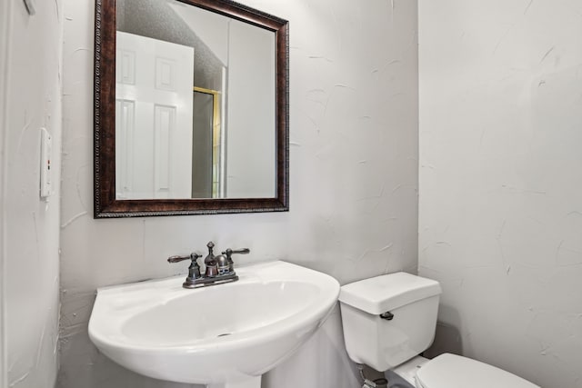 600 Harrison Hill Ct, Coppell, TX 75019 - bathroom featuring toilet and a sink