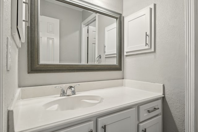 600 Harrison Hill Ct, Coppell, TX 75019 - bathroom featuring vanity and a textured wall