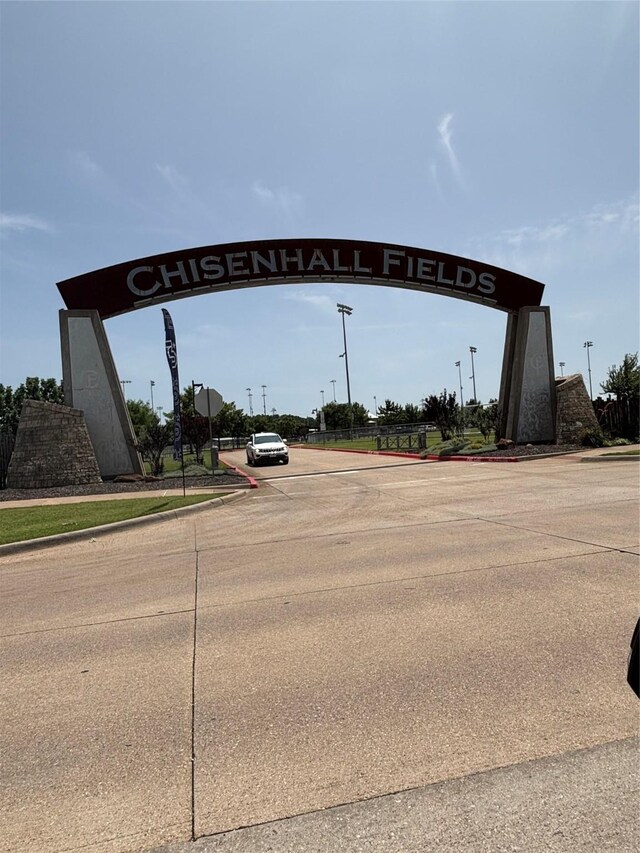 621 Lynnewood Ave, Burleson, TX 76028 - view of concrete road with curbs and traffic signs