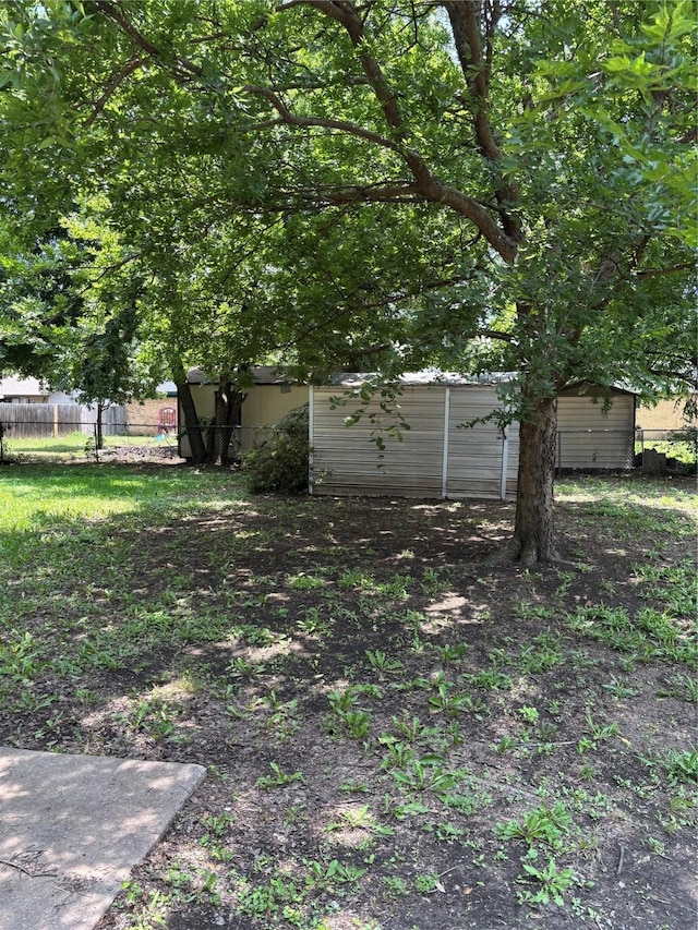 621 Lynnewood Ave, Burleson, TX 76028 - view of yard featuring an outbuilding