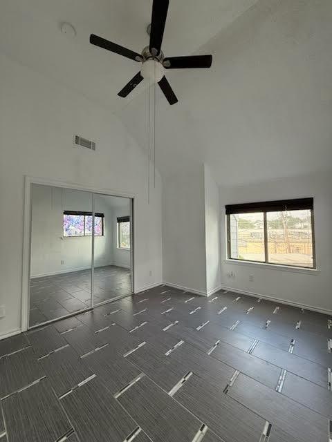 3404 W Country Club Dr Unit 264, Irving, TX 75038 - unfurnished room with high vaulted ceiling and ceiling fan