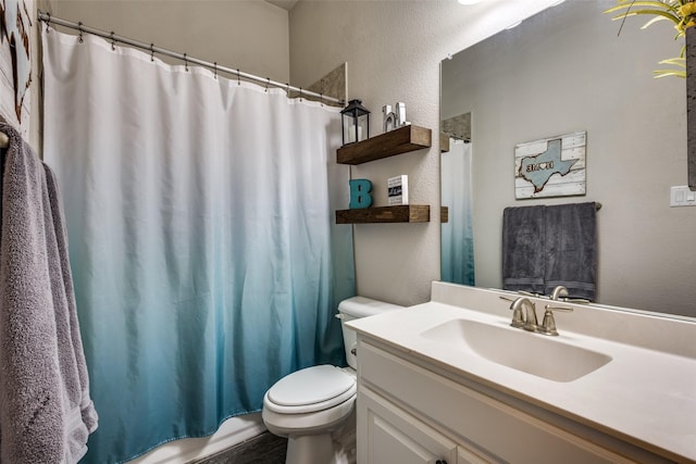 3900 Silent Water St, Mckinney, TX 75071 - full bathroom featuring toilet, vanity, and a textured wall