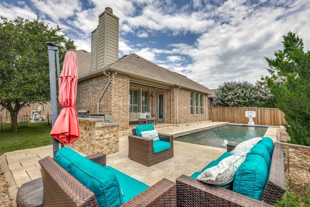 3900 Silent Water St, Mckinney, TX 75071 - view of swimming pool featuring exterior kitchen, a patio, and an outdoor living space