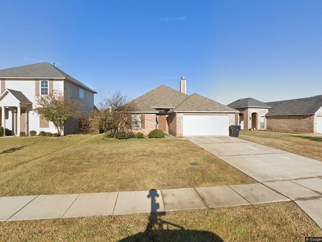 508 Linnhurst Dr, Bossier City, LA 71112 - view of front of house featuring an attached garage, concrete driveway, a chimney, a front lawn, and brick siding