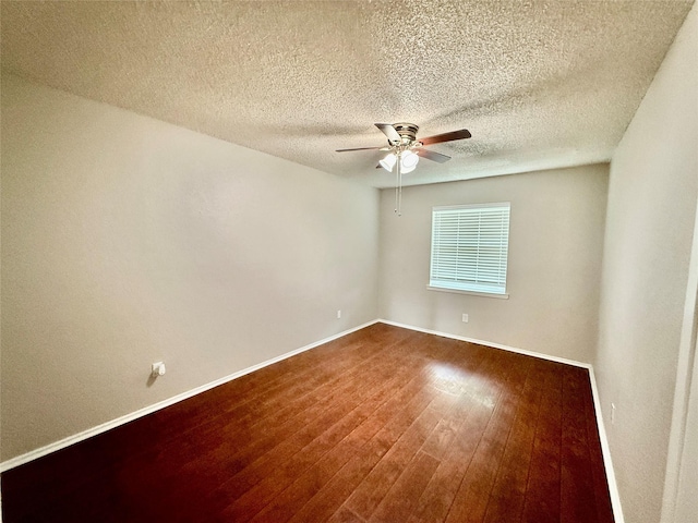517 Gristmill Ln, Everman, TX 76140 - spare room with ceiling fan, wood finished floors, baseboards, and a textured ceiling