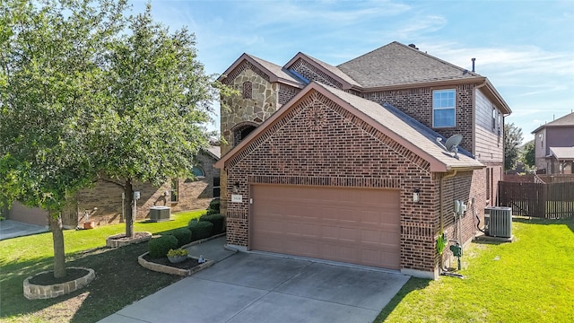 3028 Maple Creek Dr, Fort Worth, TX 76177 - view of front of house with brick siding, roof with shingles, concrete driveway, central AC, and a garage