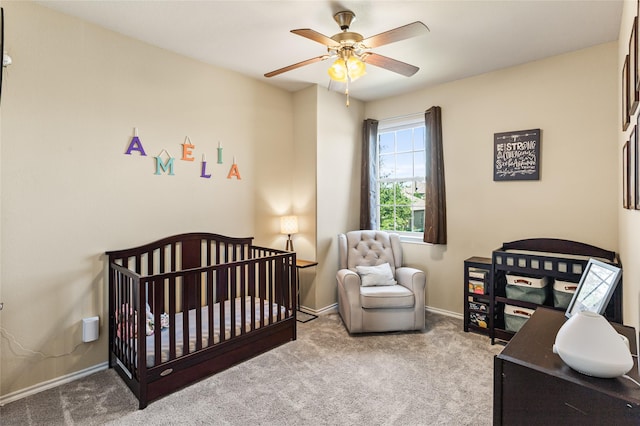 3028 Maple Creek Dr, Fort Worth, TX 76177 - carpeted bedroom with baseboards, ceiling fan, and a crib
