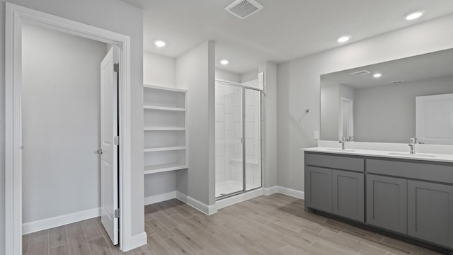 1736 River Bend Rd, Burleson, TX 76028 - full bathroom with a shower stall, double vanity, wood finished floors, baseboards, and recessed lighting