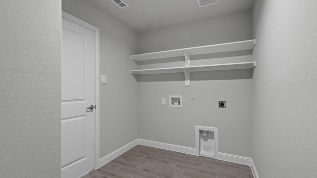 1736 River Bend Rd, Burleson, TX 76028 - washroom with hookup for an electric dryer, gas dryer hookup, hookup for a washing machine, wood tiled floors, and baseboards