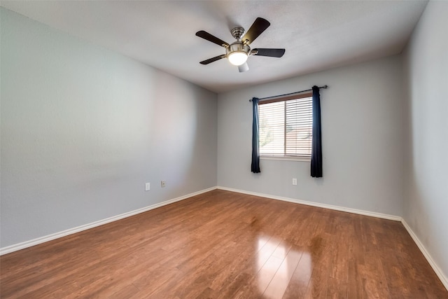 2007 Firewater Pl, Lewisville, TX 75067 - unfurnished room with wood finished floors, baseboards, and ceiling fan