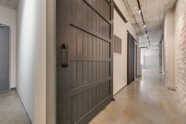 1122 Jackson St Unit 420, Dallas, TX 75202 - hallway featuring concrete floors