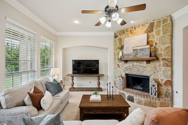 5809 Sterling Trl, Mckinney, TX 75071 - living room featuring ceiling fan, ornamental molding, and a fireplace