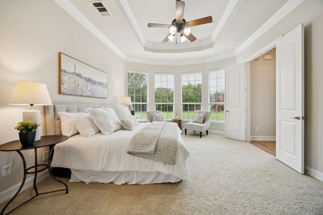 5809 Sterling Trl, Mckinney, TX 75071 - carpeted bedroom with a raised ceiling, ornamental molding, and ceiling fan