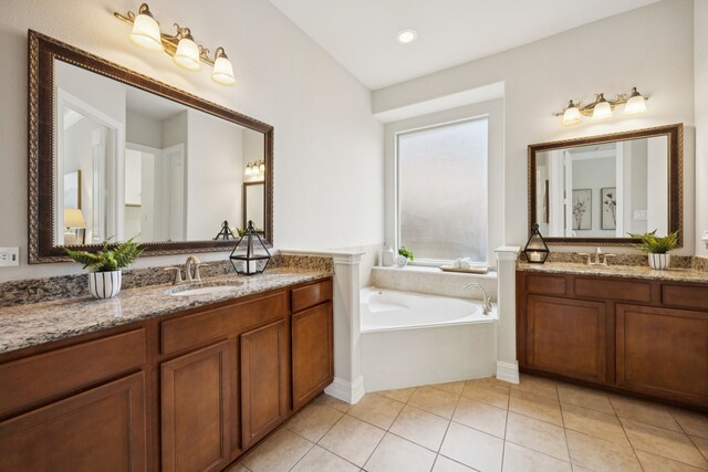 5809 Sterling Trl, Mckinney, TX 75071 - bathroom with two vanities, a bath, and tile patterned flooring