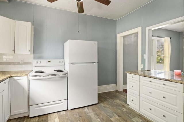 408 W Trinity St, Groesbeck, TX 76642 - kitchen featuring white appliances, ceiling fan, dark wood-style floors, and white cabinets