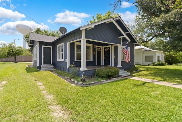 408 W Trinity St, Groesbeck, TX 76642 - view of front facade featuring a front lawn, covered porch, and entry steps