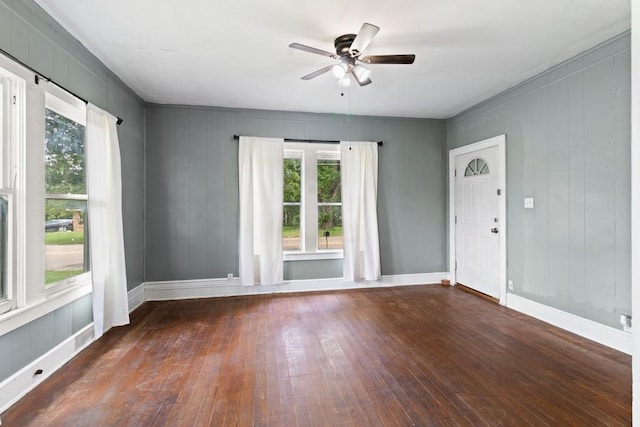 408 W Trinity St, Groesbeck, TX 76642 - unfurnished room with hardwood / wood-style floors, plenty of natural light, and ceiling fan