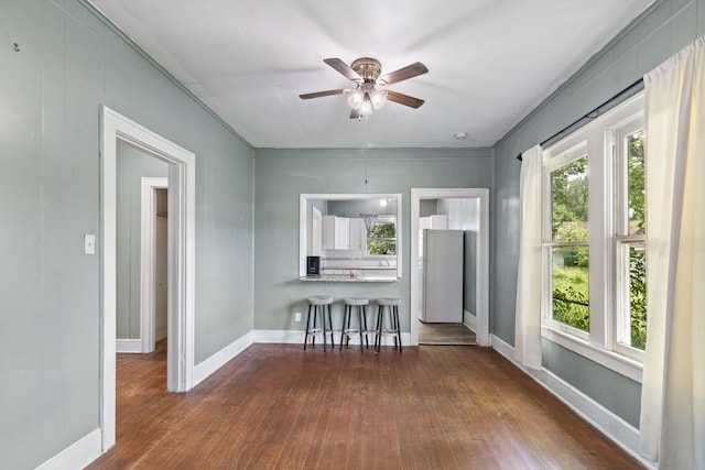 408 W Trinity St, Groesbeck, TX 76642 - dining space with dark wood-type flooring and ceiling fan