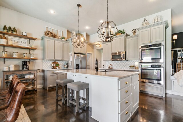 2011 Twin Creeks Cir, Pilot Point, TX 76258 - kitchen featuring appliances with stainless steel finishes, a chandelier, a sink, light countertops, and concrete flooring