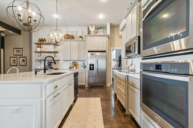 2011 Twin Creeks Cir, Pilot Point, TX 76258 - kitchen featuring appliances with stainless steel finishes, a sink, a chandelier, decorative backsplash, and light countertops