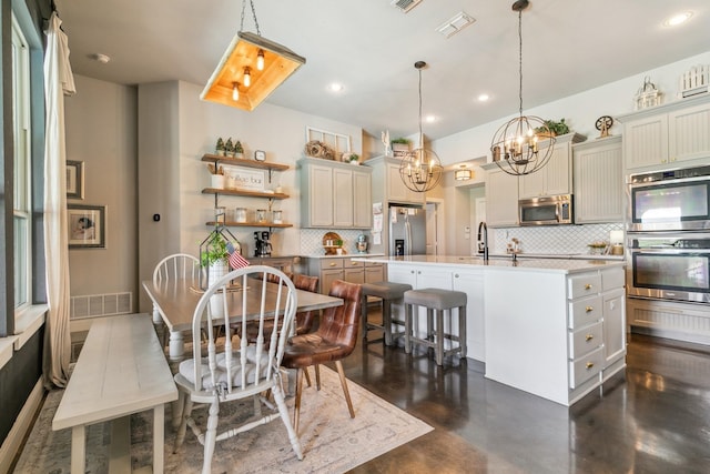 2011 Twin Creeks Cir, Pilot Point, TX 76258 - dining area with a chandelier, finished concrete flooring, and recessed lighting