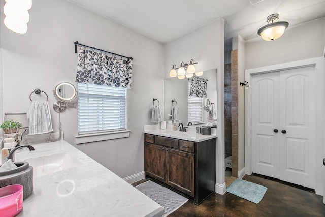2011 Twin Creeks Cir, Pilot Point, TX 76258 - bathroom with vanity, tiled shower, finished concrete flooring, and baseboards