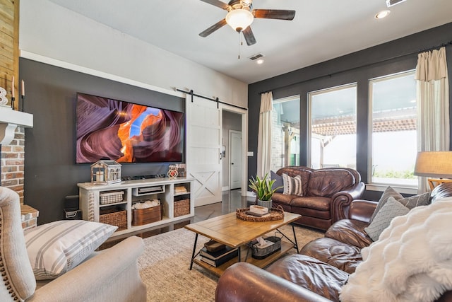 2011 Twin Creeks Cir, Pilot Point, TX 76258 - living room with a barn door, a ceiling fan, recessed lighting, and wood finished floors