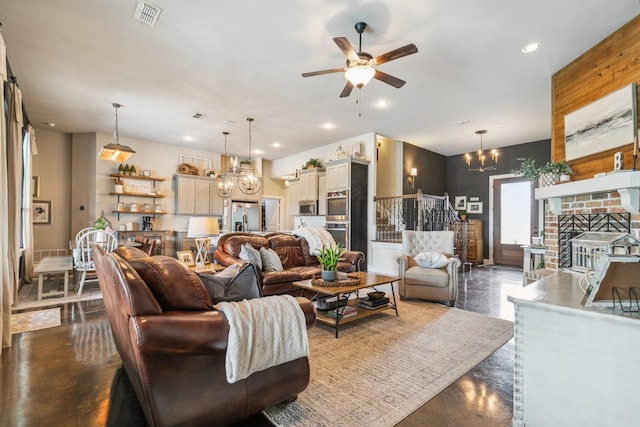 2011 Twin Creeks Cir, Pilot Point, TX 76258 - living room featuring a chandelier, a ceiling fan, concrete flooring, recessed lighting, and a fireplace