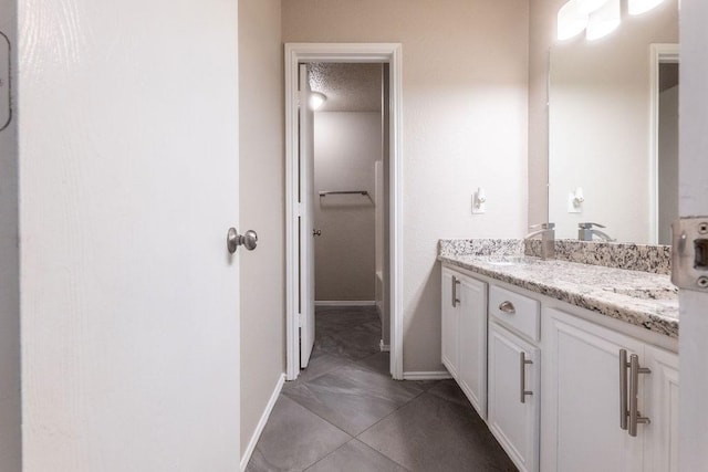 6104 Brookfall Dr, Arlington, TX 76018 - bathroom with vanity and baseboards