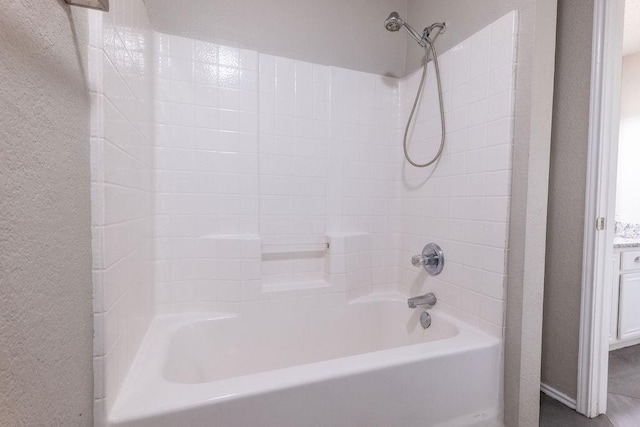 6104 Brookfall Dr, Arlington, TX 76018 - full bathroom featuring shower / bath combination and a textured wall