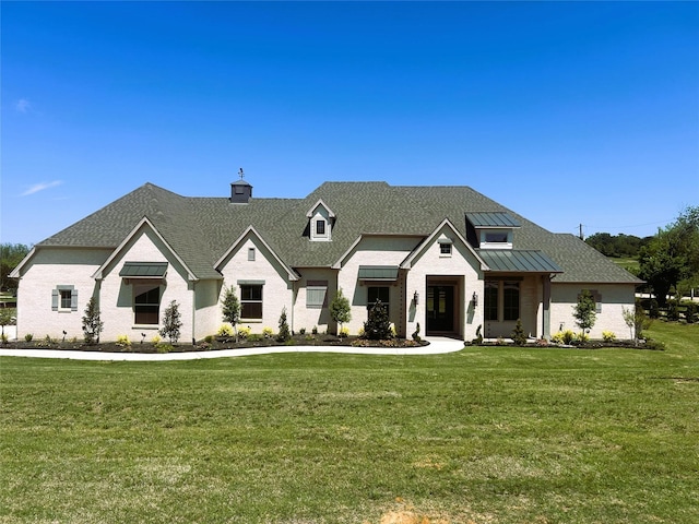 9604 Hester Ln, Argyle, TX 76226 - modern farmhouse with a standing seam roof, a chimney, a front lawn, and metal roof