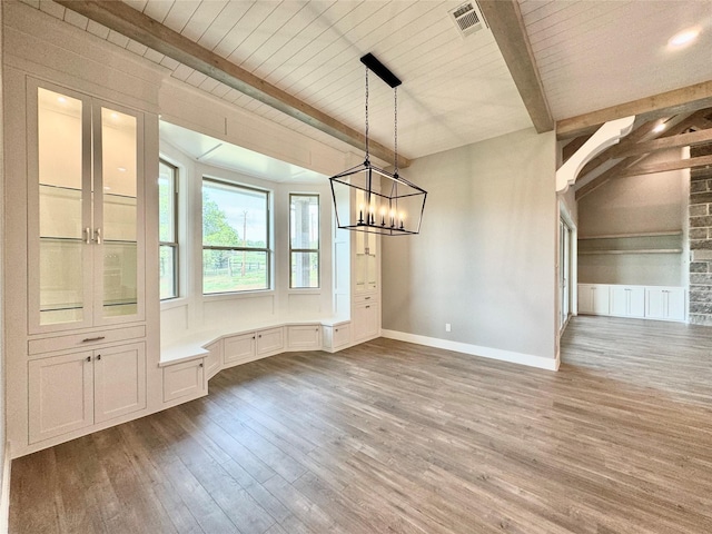 9604 Hester Ln, Argyle, TX 76226 - unfurnished dining area featuring wood finished floors, a chandelier, wooden ceiling, and baseboards