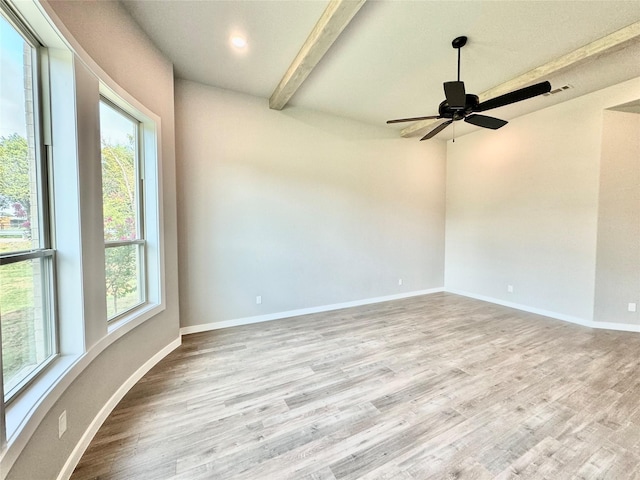 9604 Hester Ln, Argyle, TX 76226 - empty room featuring healthy amount of natural light, beamed ceiling, wood finished floors, and baseboards