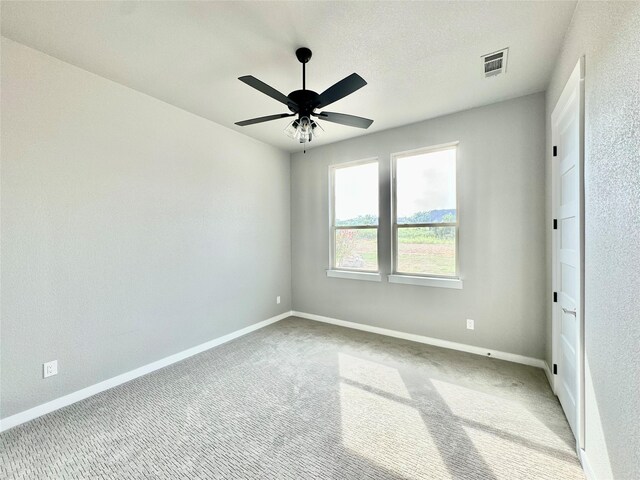 9604 Hester Ln, Argyle, TX 76226 - unfurnished bedroom featuring carpet flooring, baseboards, and ceiling fan