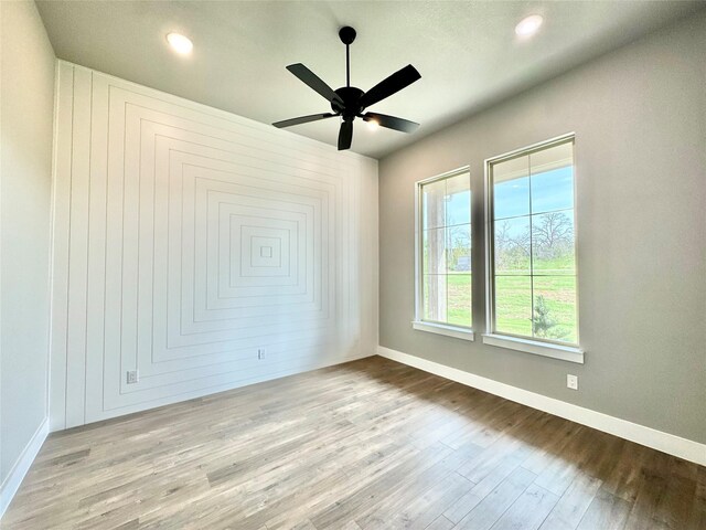 9604 Hester Ln, Argyle, TX 76226 - empty room with wood finished floors, baseboards, ceiling fan, and recessed lighting