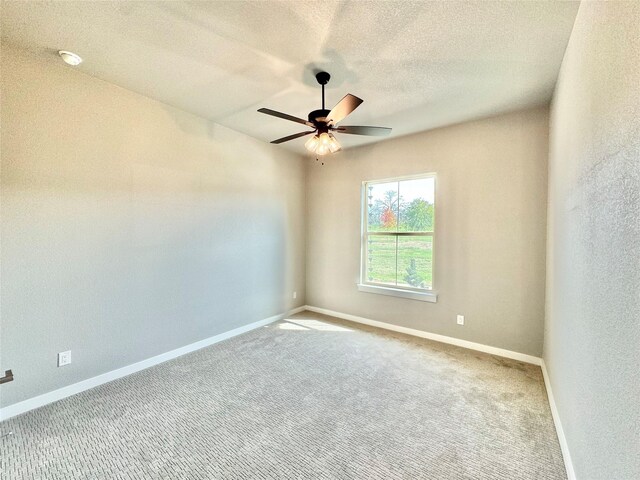 9604 Hester Ln, Argyle, TX 76226 - unfurnished room featuring a ceiling fan, carpet flooring, baseboards, a textured ceiling, and a smoke detector