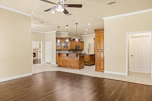 3600 Big Timber Ln, Granbury, TX 76049 - unfurnished living room featuring a ceiling fan, light wood finished floors, recessed lighting, baseboards, and ornamental molding